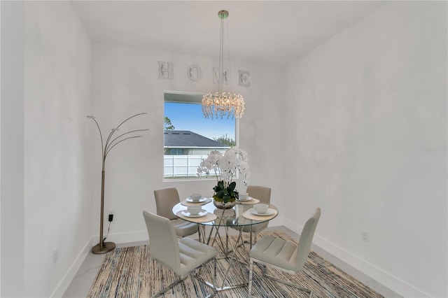 dining room with a notable chandelier