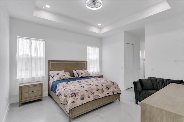 bedroom with a tray ceiling