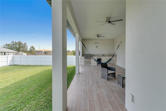 view of patio / terrace featuring ceiling fan