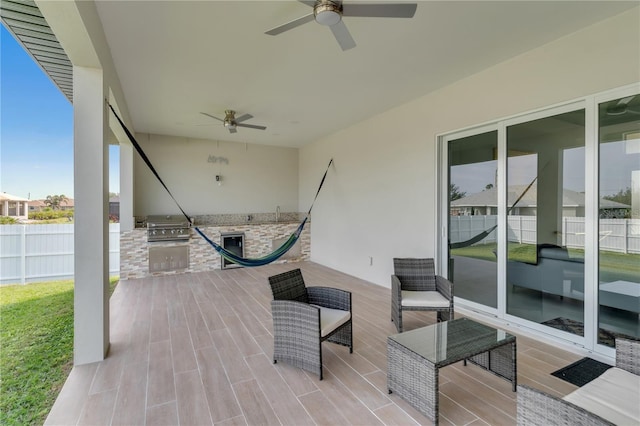 view of patio / terrace with a grill and ceiling fan