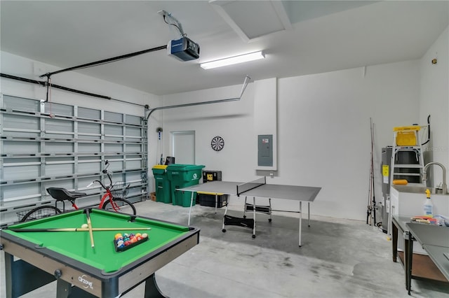 rec room featuring electric panel and concrete floors