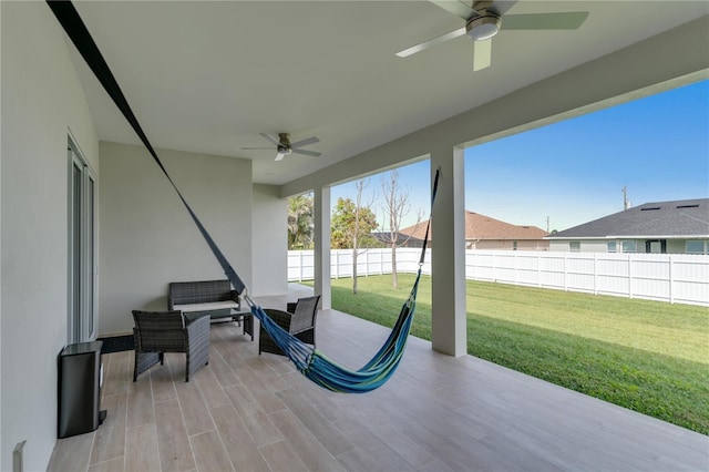 view of patio / terrace featuring ceiling fan