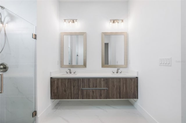 bathroom with vanity and a shower with shower door