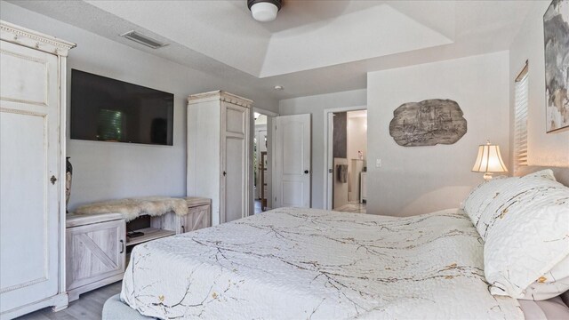 bedroom with ceiling fan and light hardwood / wood-style flooring