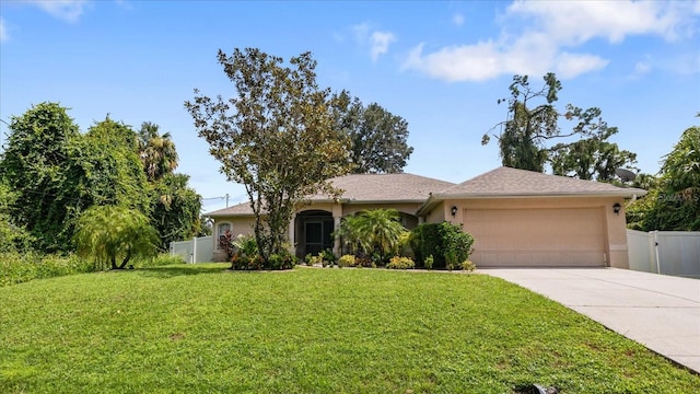 single story home with a front lawn and a garage