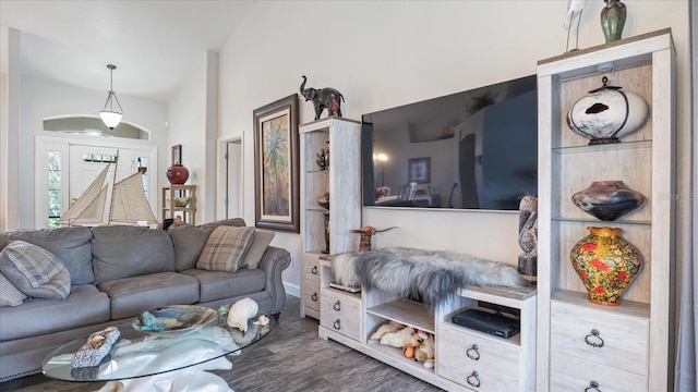 living room with dark wood-type flooring and vaulted ceiling