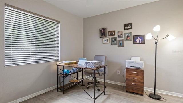 home office with light wood-type flooring