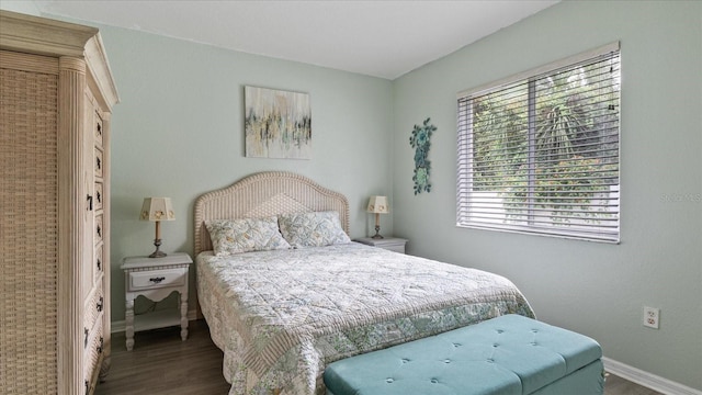 bedroom with hardwood / wood-style floors