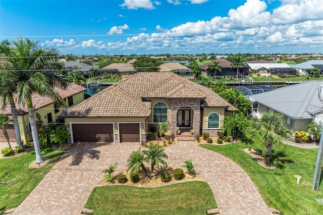 mediterranean / spanish-style house with a front lawn and a garage