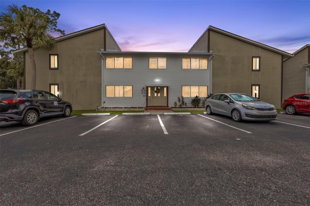 view of outdoor building at dusk