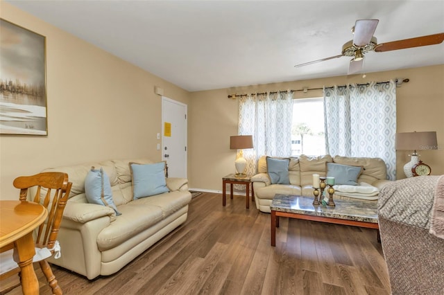 living room with ceiling fan and hardwood / wood-style flooring