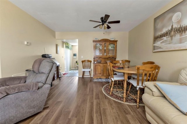 dining room featuring ceiling fan and hardwood / wood-style flooring