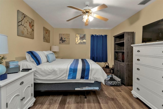 bedroom featuring wood-type flooring and ceiling fan