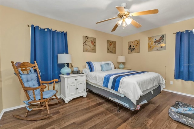 bedroom with ceiling fan and dark hardwood / wood-style floors