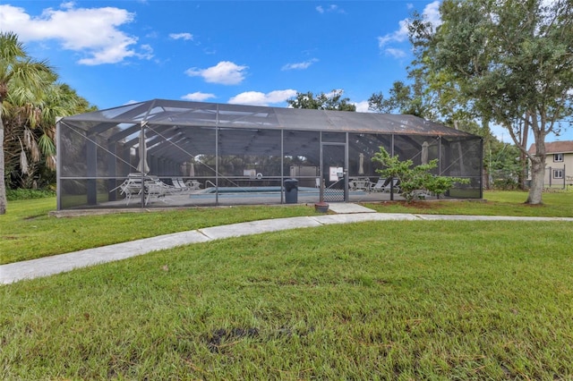 view of community with a lawn and a pool