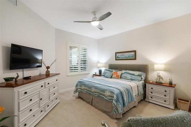 bedroom featuring ceiling fan and light carpet