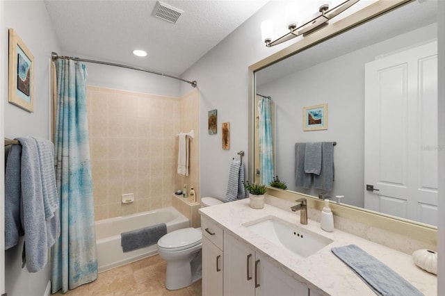 full bathroom featuring shower / bath combination with curtain, vanity, toilet, a textured ceiling, and tile patterned flooring