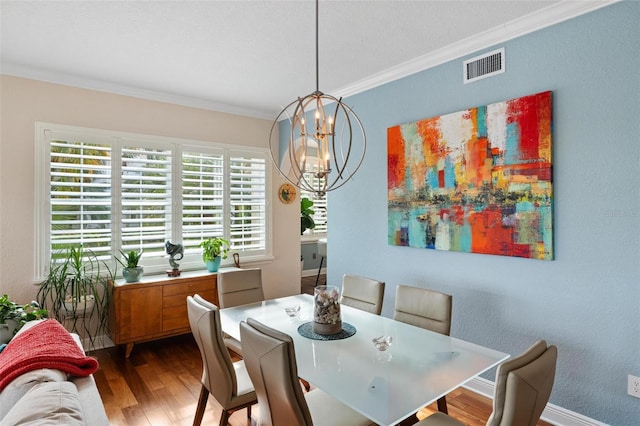 dining space with an inviting chandelier, wood-type flooring, and ornamental molding