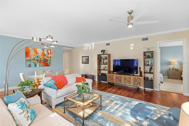 living room featuring ornamental molding, ceiling fan, and dark wood-type flooring