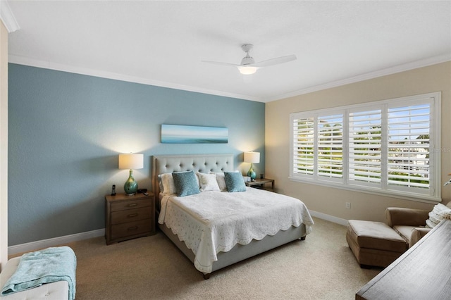 carpeted bedroom with crown molding and ceiling fan