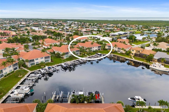 birds eye view of property featuring a water view