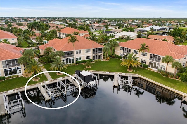 birds eye view of property featuring a water view