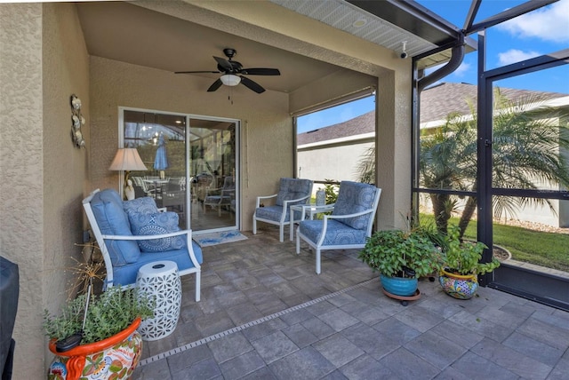 sunroom / solarium with ceiling fan