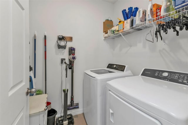 clothes washing area featuring washing machine and dryer