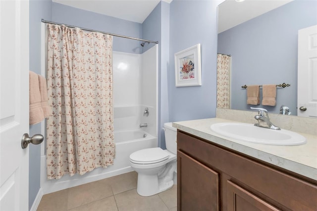 full bathroom featuring vanity, shower / bath combo with shower curtain, toilet, and tile patterned floors