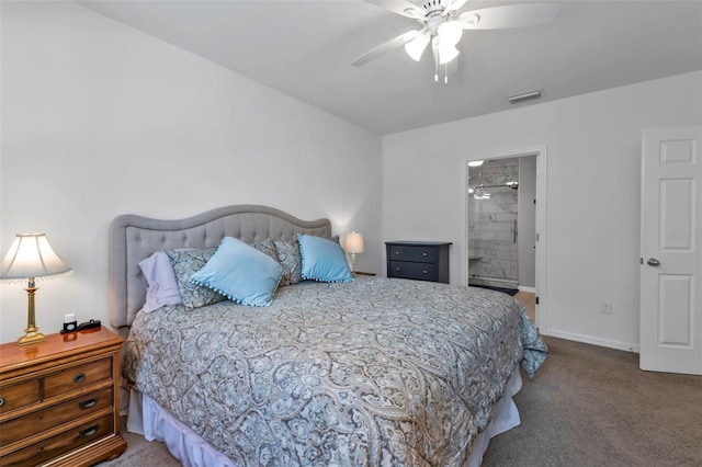 bedroom with ceiling fan, ensuite bathroom, and carpet flooring