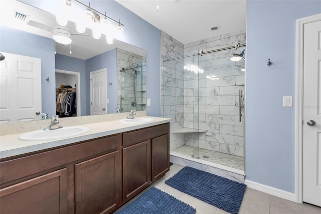 bathroom featuring vanity, tile patterned flooring, ceiling fan, and a shower with shower door