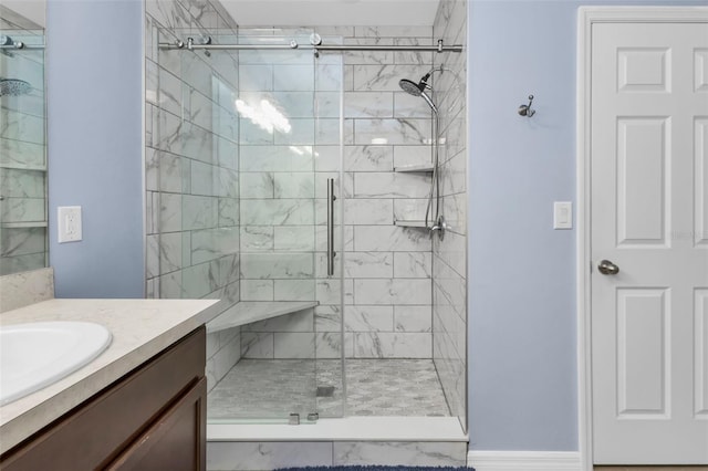 bathroom featuring walk in shower and vanity