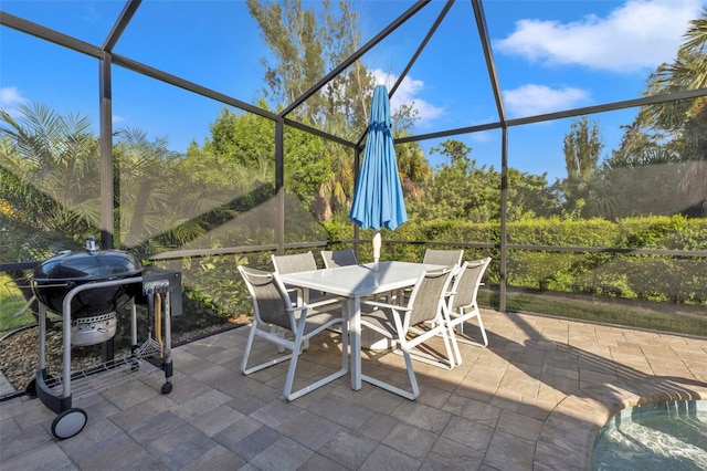 view of patio / terrace with glass enclosure and grilling area