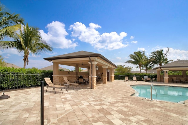 view of swimming pool featuring a gazebo and a patio area