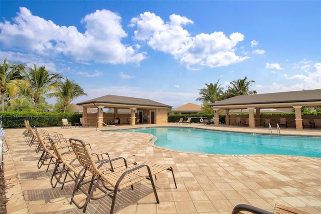 view of pool with a patio and a gazebo