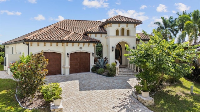 mediterranean / spanish-style house featuring a garage