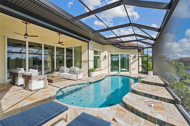 view of swimming pool with outdoor lounge area, glass enclosure, a patio, and ceiling fan