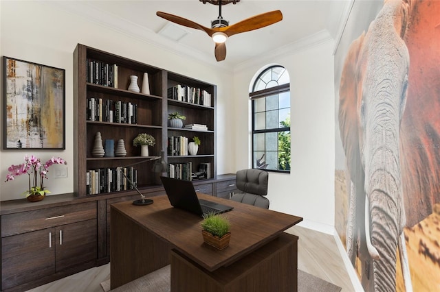 office area with ornamental molding, ceiling fan, and light hardwood / wood-style flooring