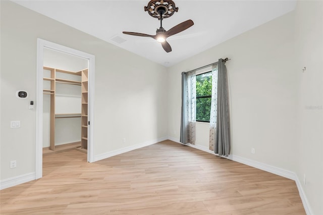 spare room featuring ceiling fan and light hardwood / wood-style flooring