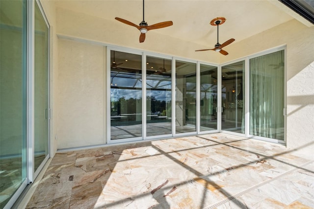 view of patio featuring ceiling fan