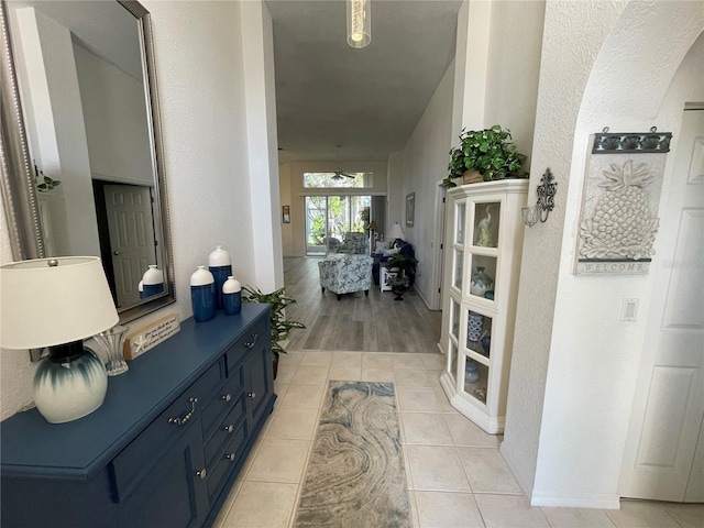 corridor with light hardwood / wood-style flooring