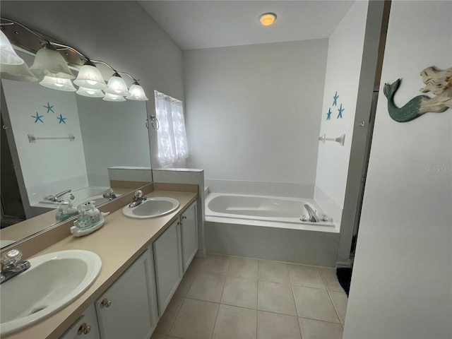 bathroom with tile patterned flooring, vanity, and a tub