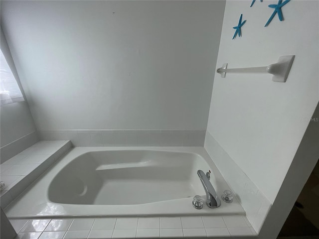 bathroom featuring a relaxing tiled tub