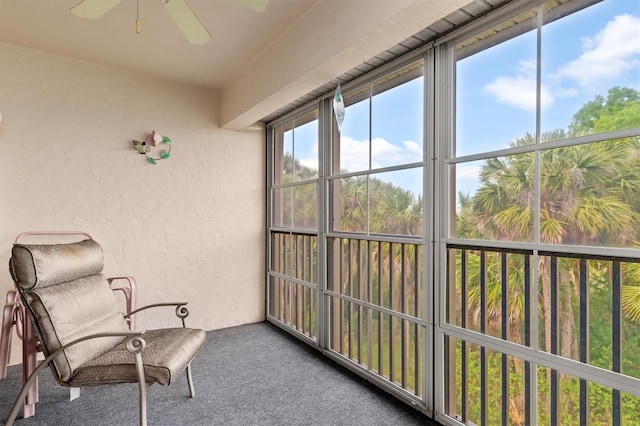 sunroom featuring ceiling fan