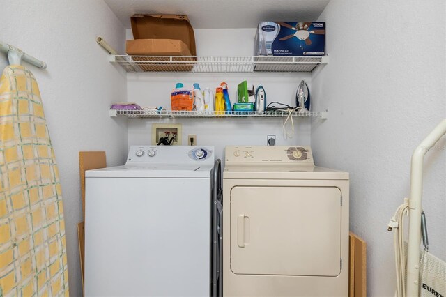 laundry room with washer and clothes dryer