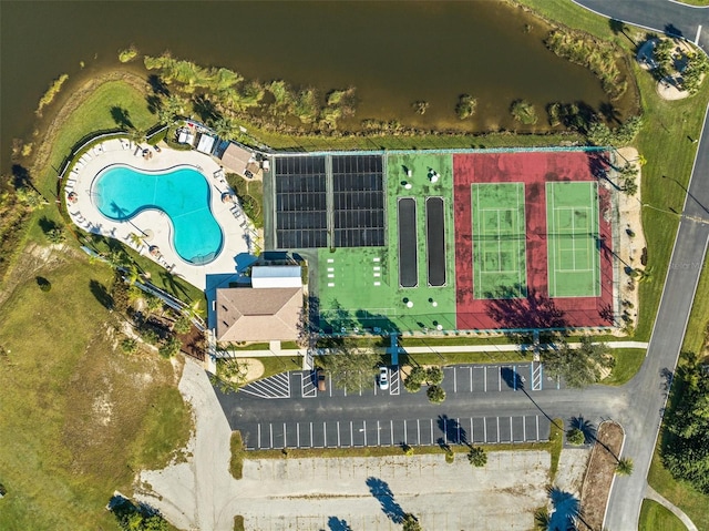 birds eye view of property with a water view