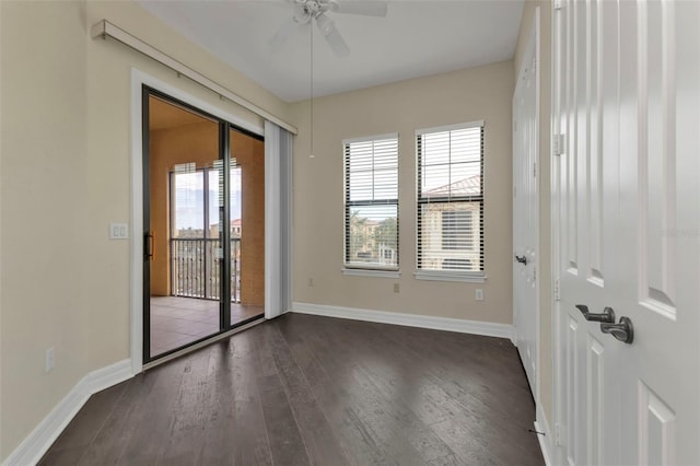 empty room featuring dark hardwood / wood-style floors and ceiling fan