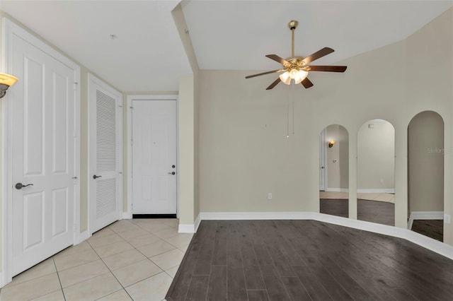 unfurnished room featuring light tile patterned floors and ceiling fan