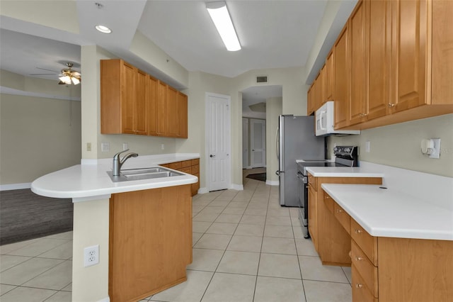 kitchen with ceiling fan, sink, black range with electric cooktop, kitchen peninsula, and light tile patterned floors