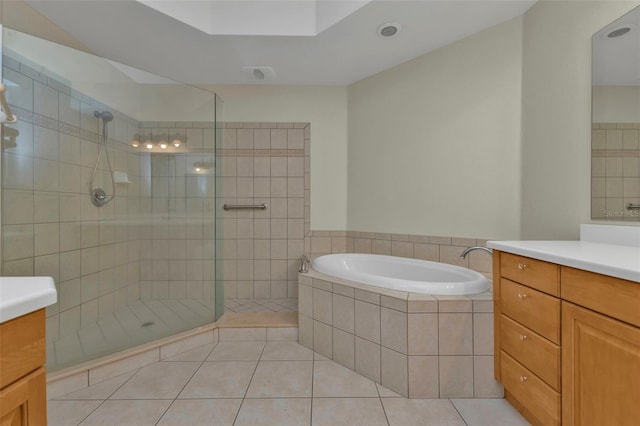 bathroom with separate shower and tub, tile patterned flooring, and vanity